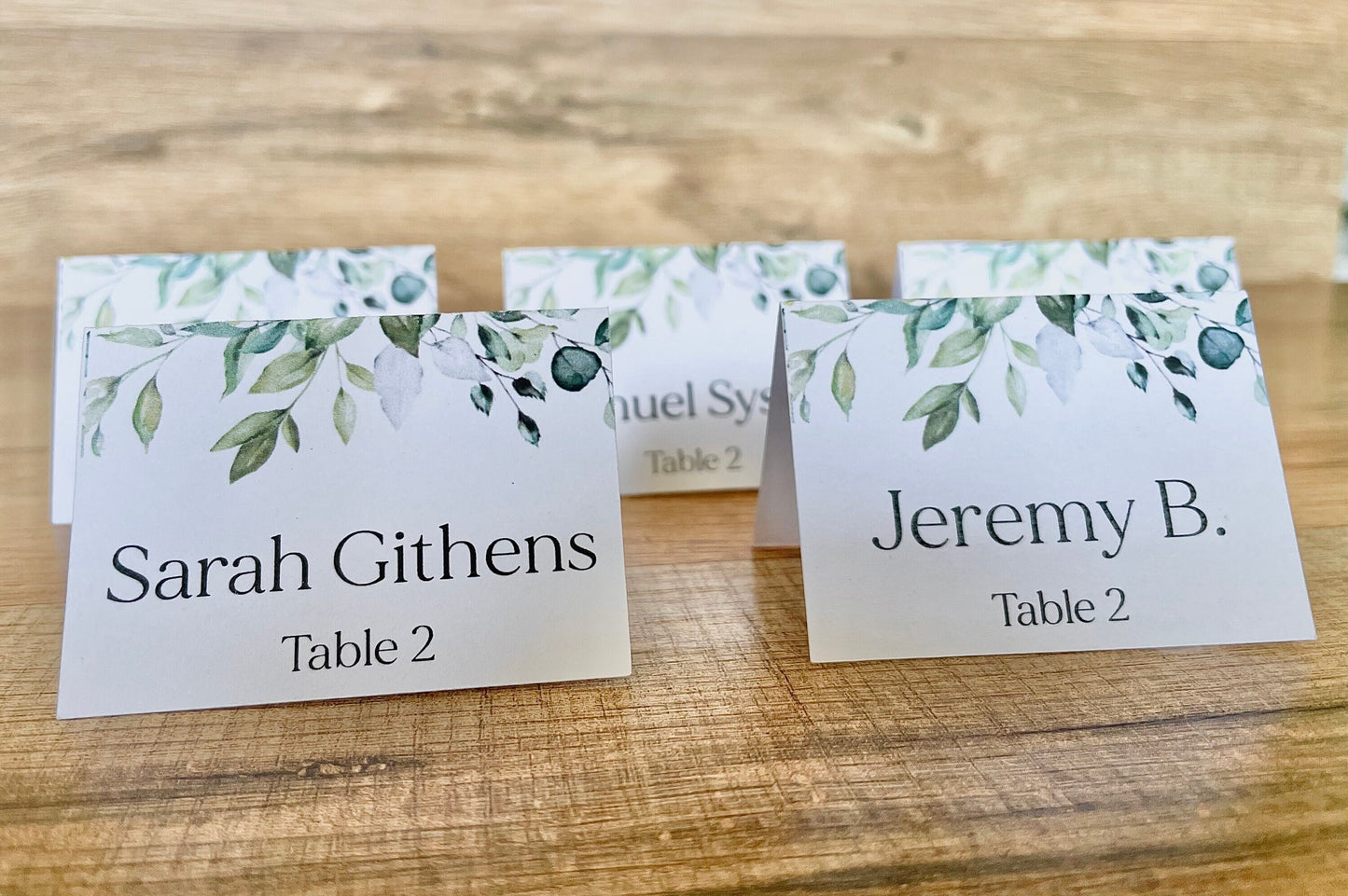 Wedding name tags place cards with greenery on top