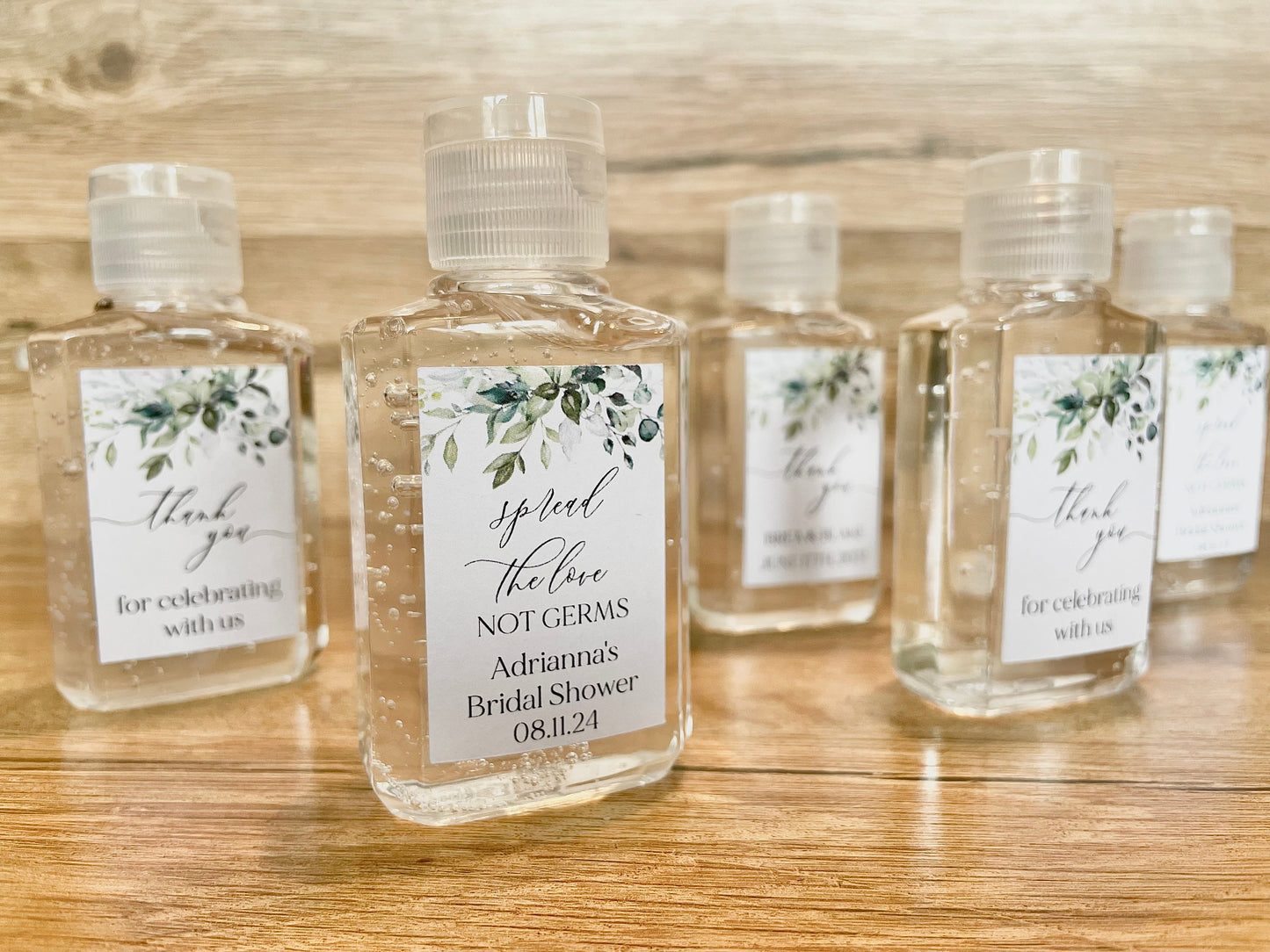 Hand sanitizer wedding favors with personalized tag with greenery design