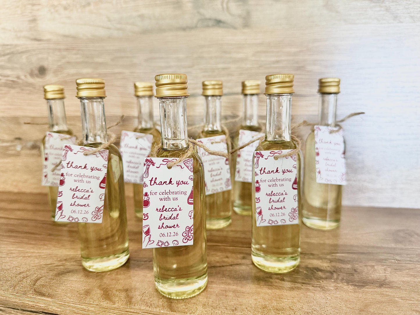 ”that’s Amore” bridal shower olive oil favors in a clear glass bottle with gold lid